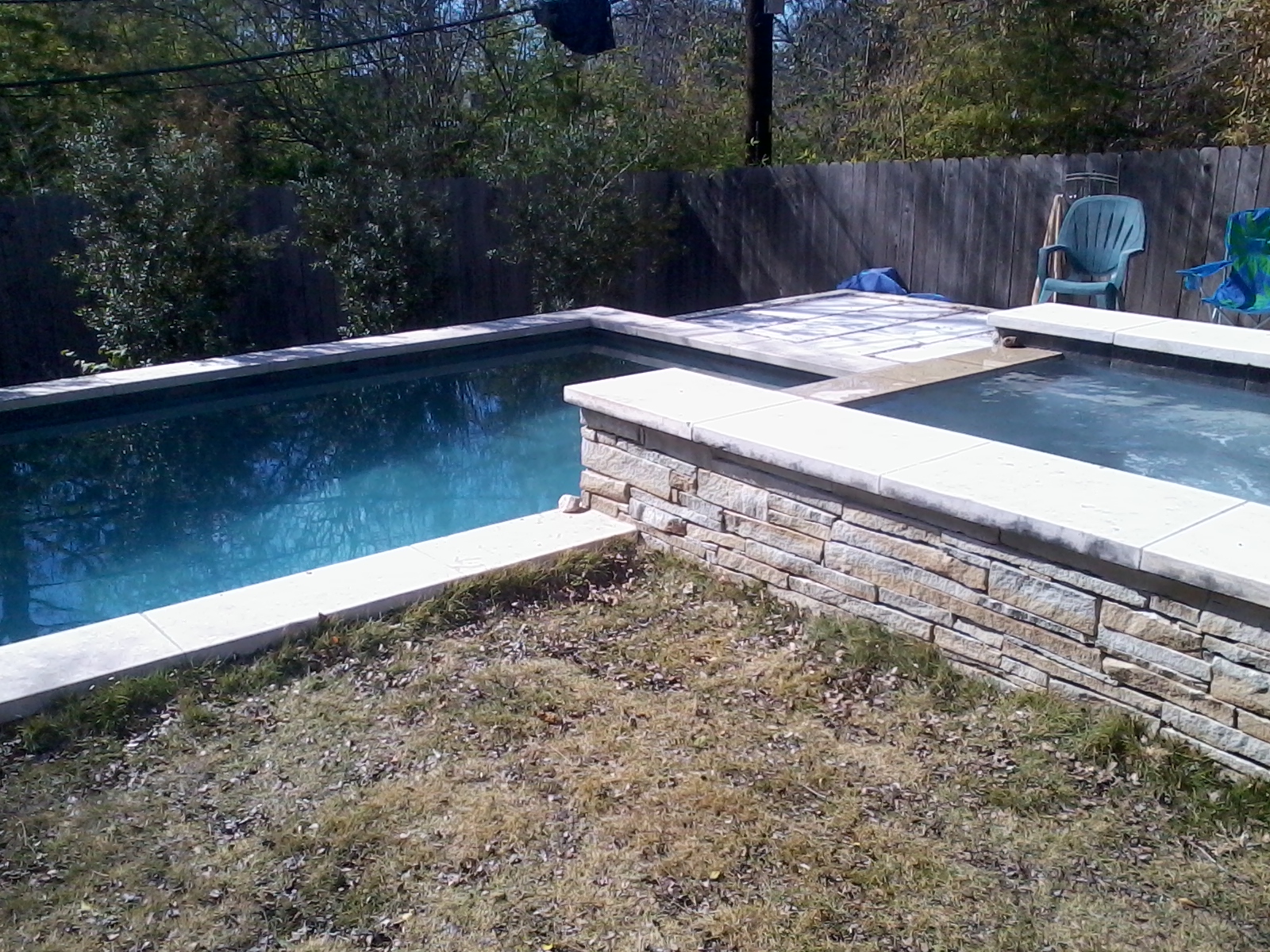 Completed poolside lounging area designed for relaxation
