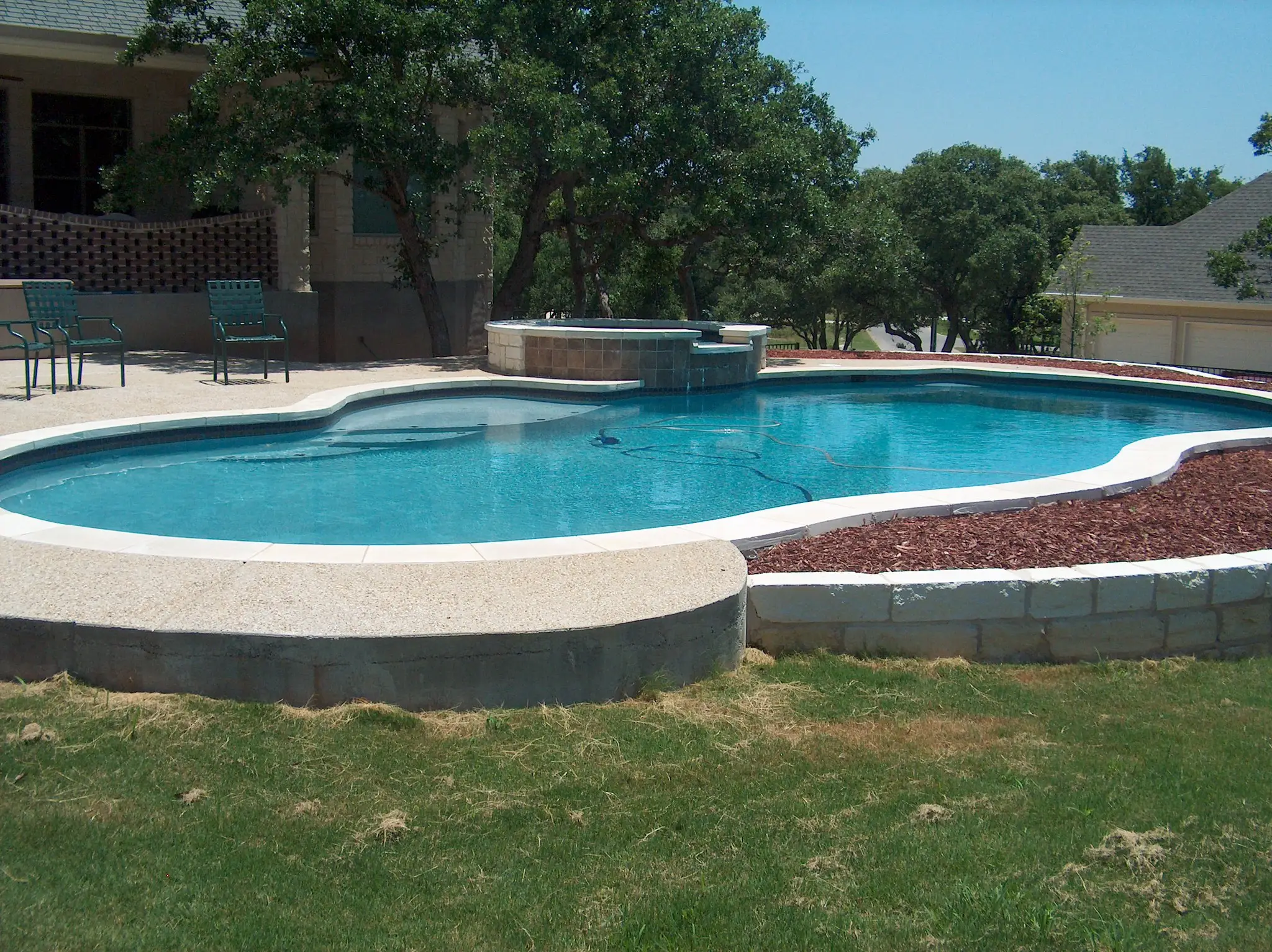 Relaxing outdoor space featuring a modern pool. Relaxing outdoor space featuring a modern pool.